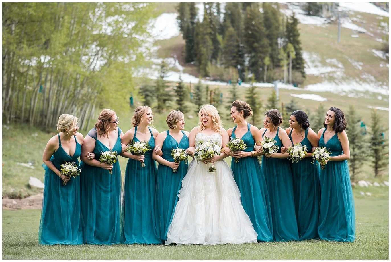 bridesmaids in teal bridesmaids dresses Beaver Creek wedding photo