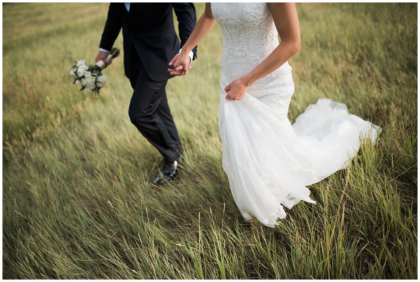 bride in lace wedding dress grass fields photo