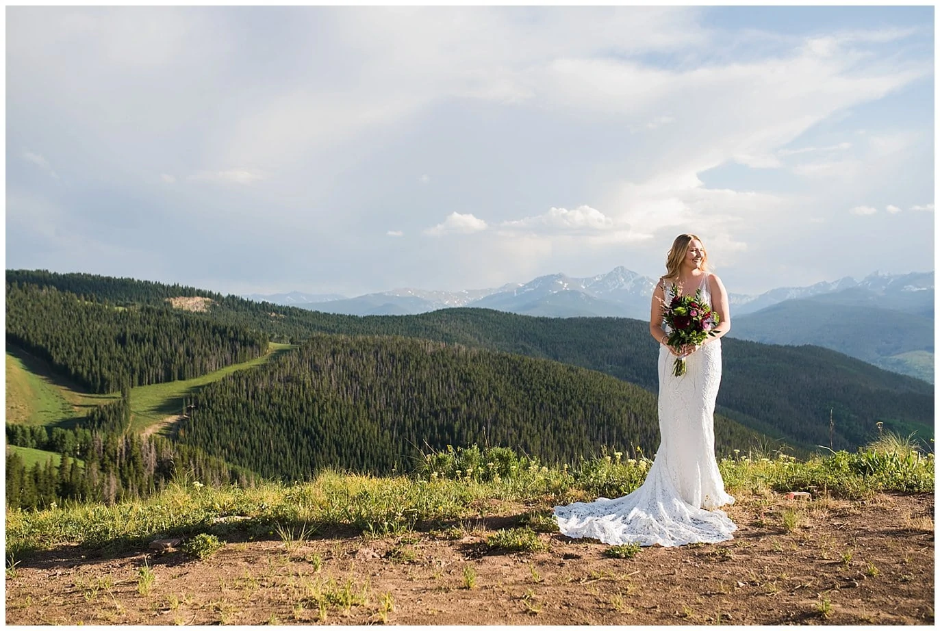 bride before ceremony in lace wedding dress at montaintop summer wedding in Vail Colorado