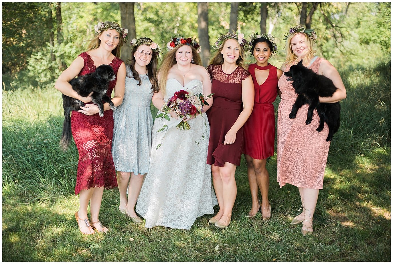 mismatched bridesmaid red dresses at Denver Botanic Gardens at Chatfield wedding by Lyons wedding photographer Jennie Crate photographer