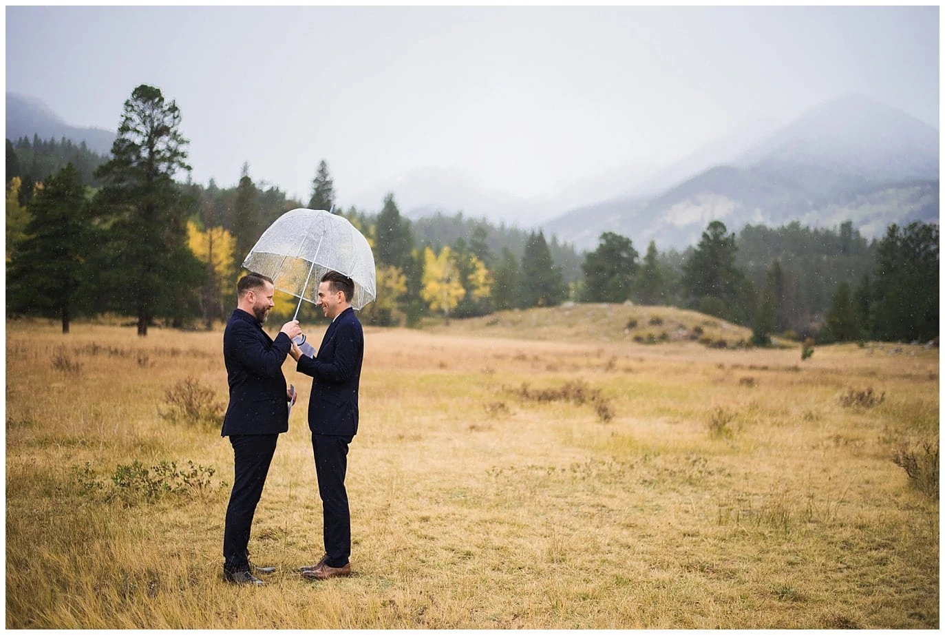 exchanging vows under umbrella photo