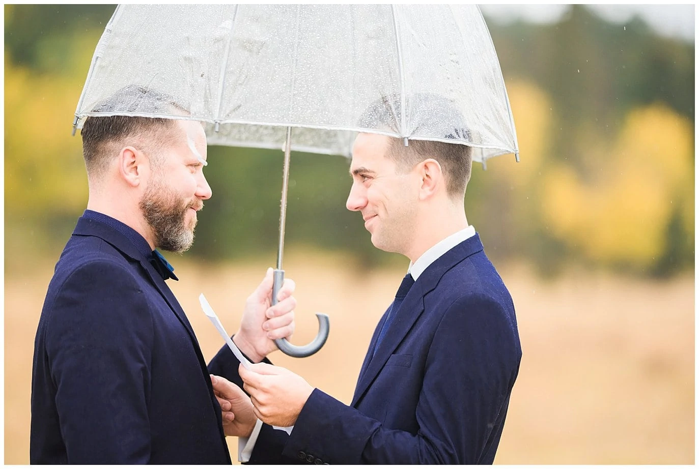 grooms saying vows in rainy elopement photo