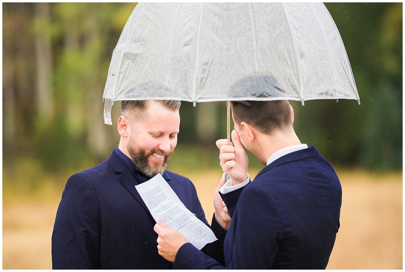 grooms saying vows in rain photo