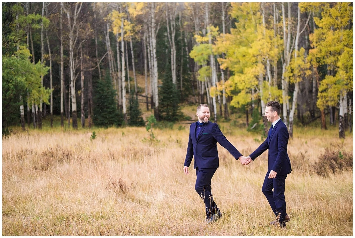 grooms walking in Colorado aspens photo