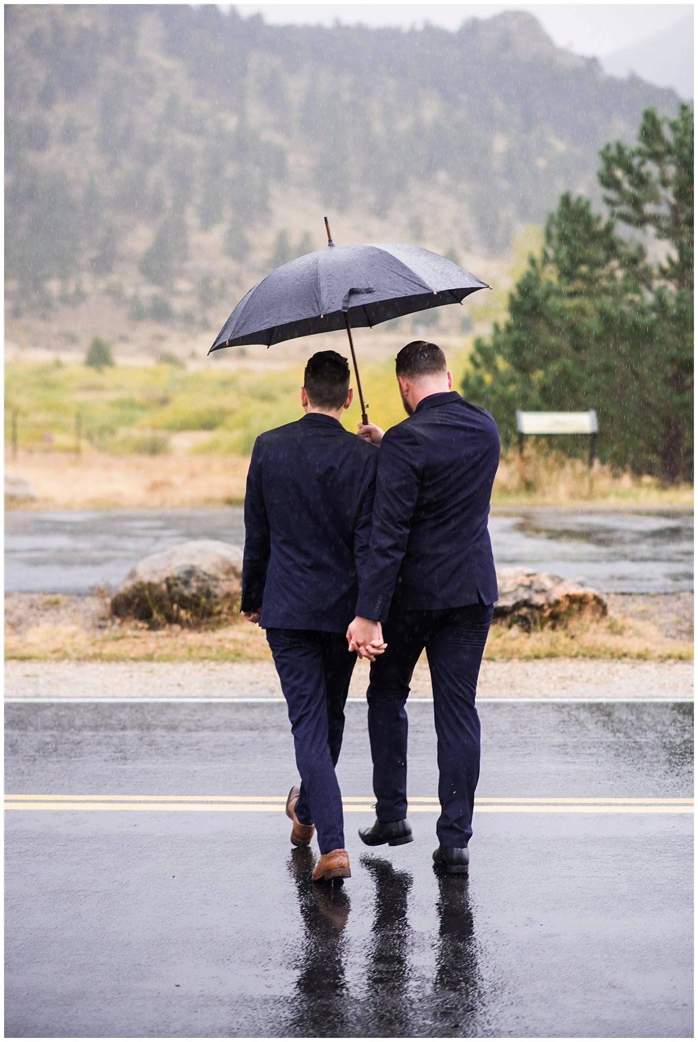 two grooms rainy day mountain elopement photo