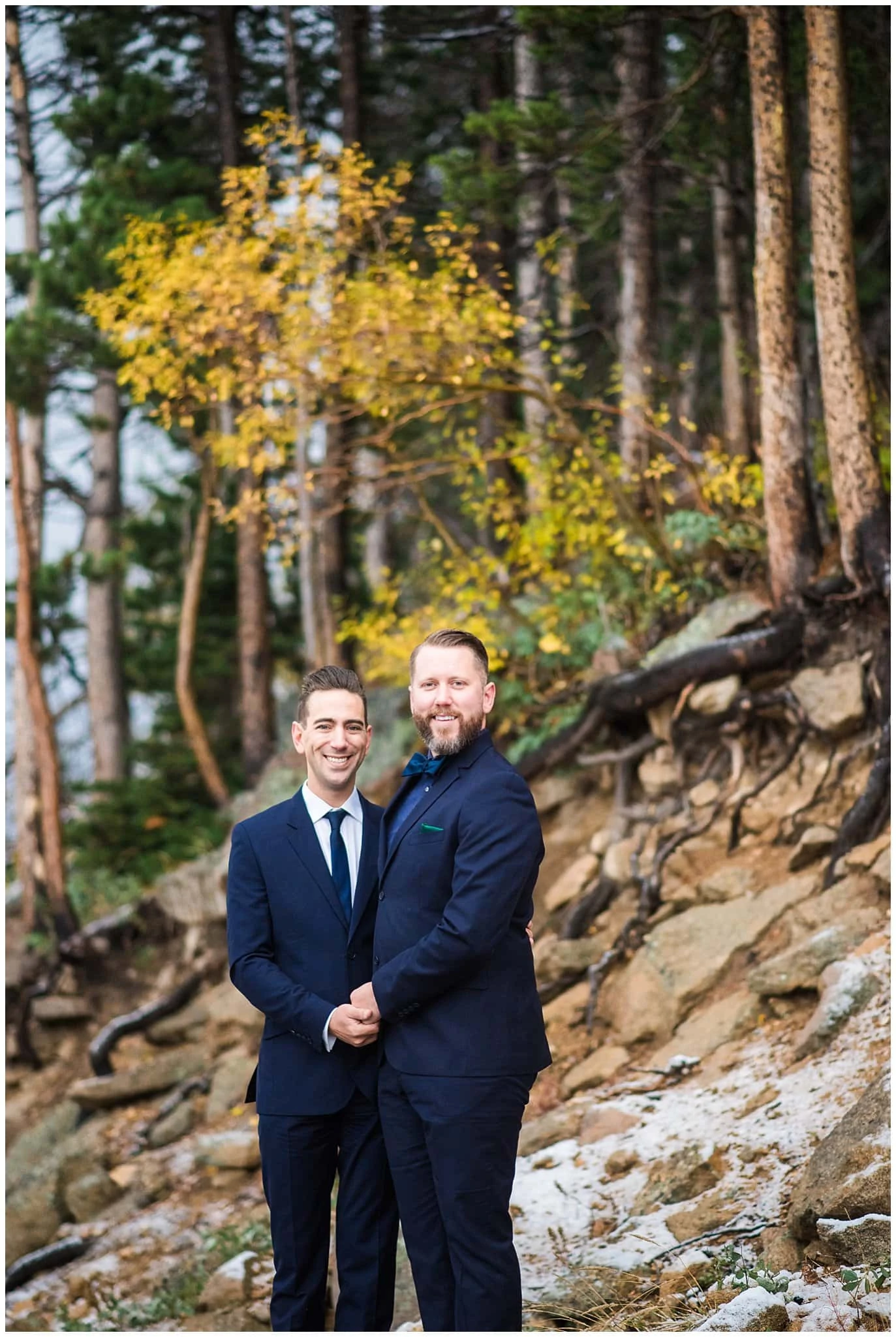 grooms in navy suits fall elopement photo