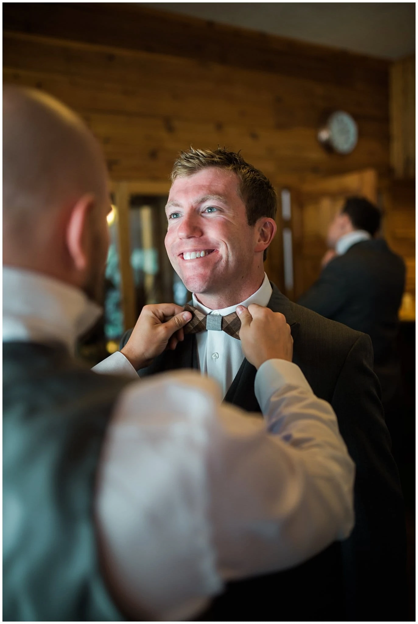 groom with wooden bow tie photo