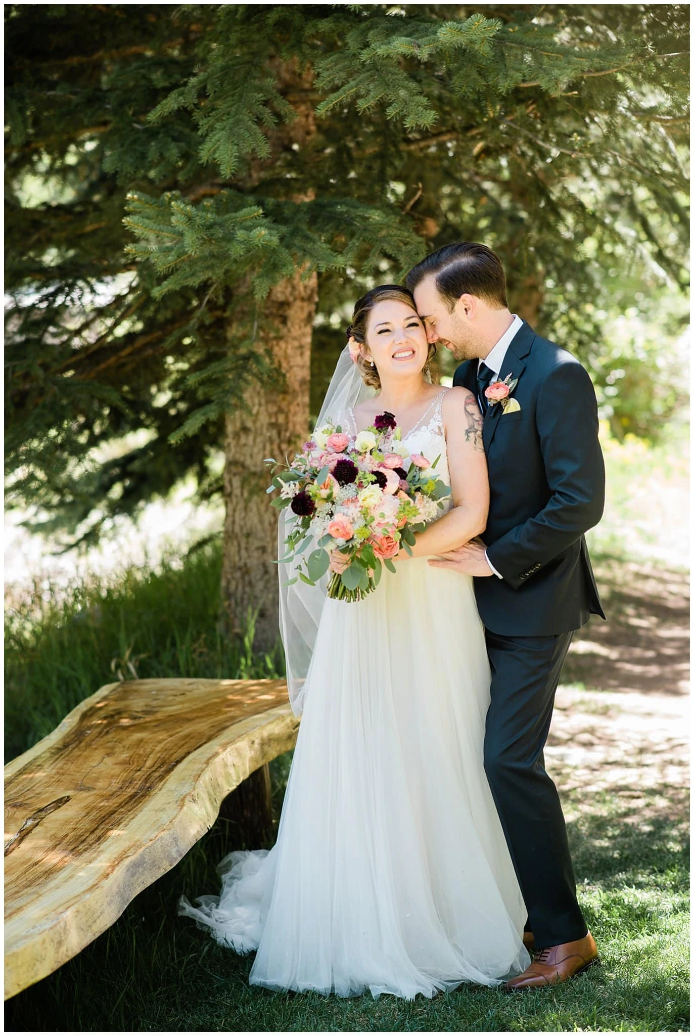 Bride and groom cuddling at Sonnenalp Hotel Vail Colorado Wedding by Aspen Wedding Photographer Jennie Crate