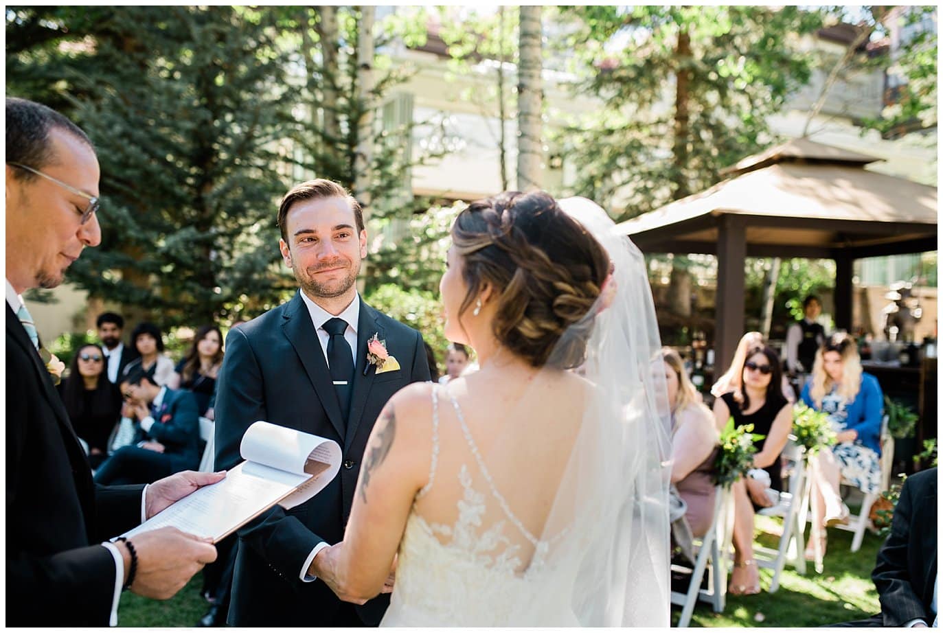groom looking at bride at Sonnenalp Hotel Vail Colorado Wedding by Aspen Wedding Photographer Jennie Crate
