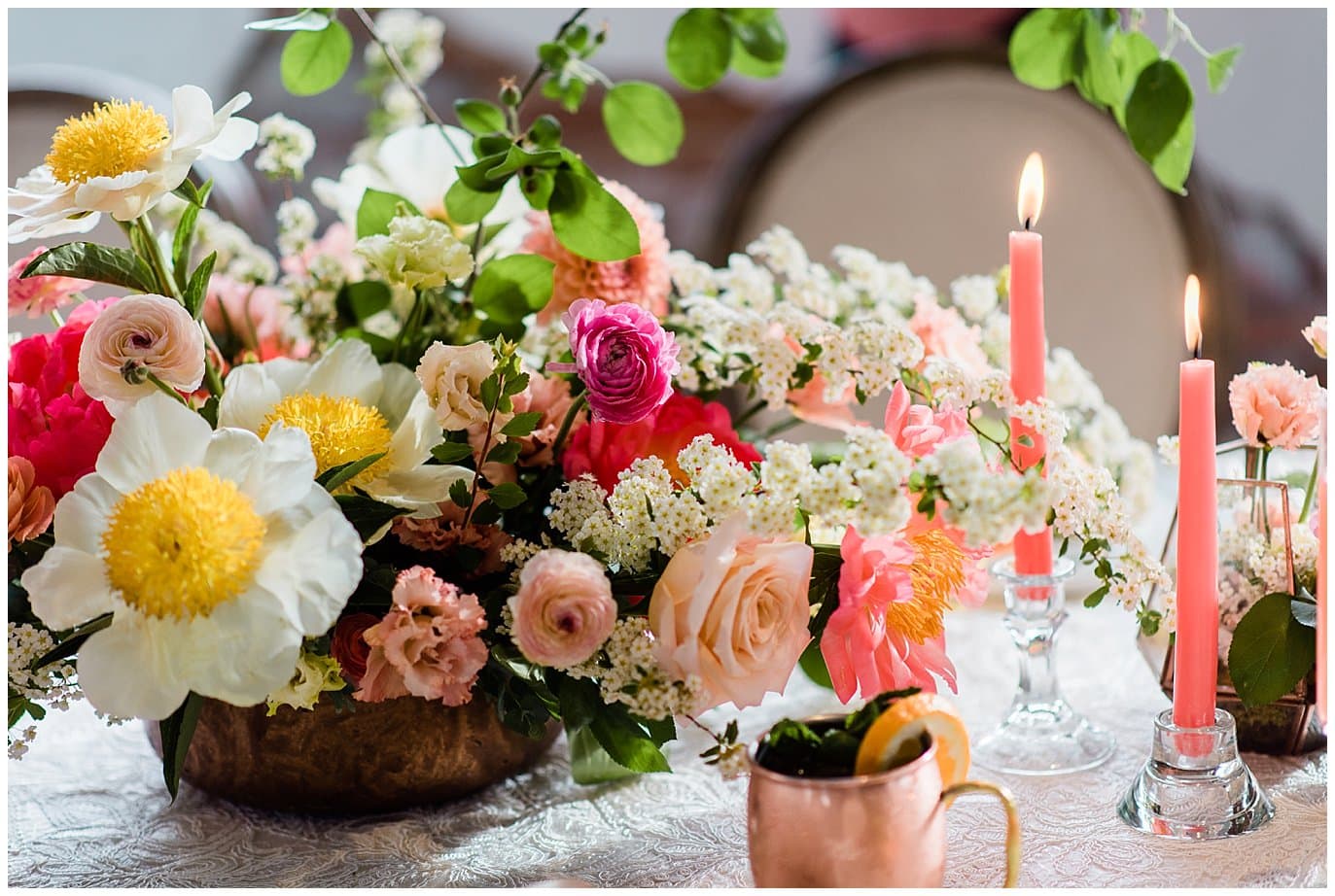 colorful wedding table with coral and ivory flowers and copper mugs at summer blanc wedding by blanc wedding photographer Jennie Crate photographer