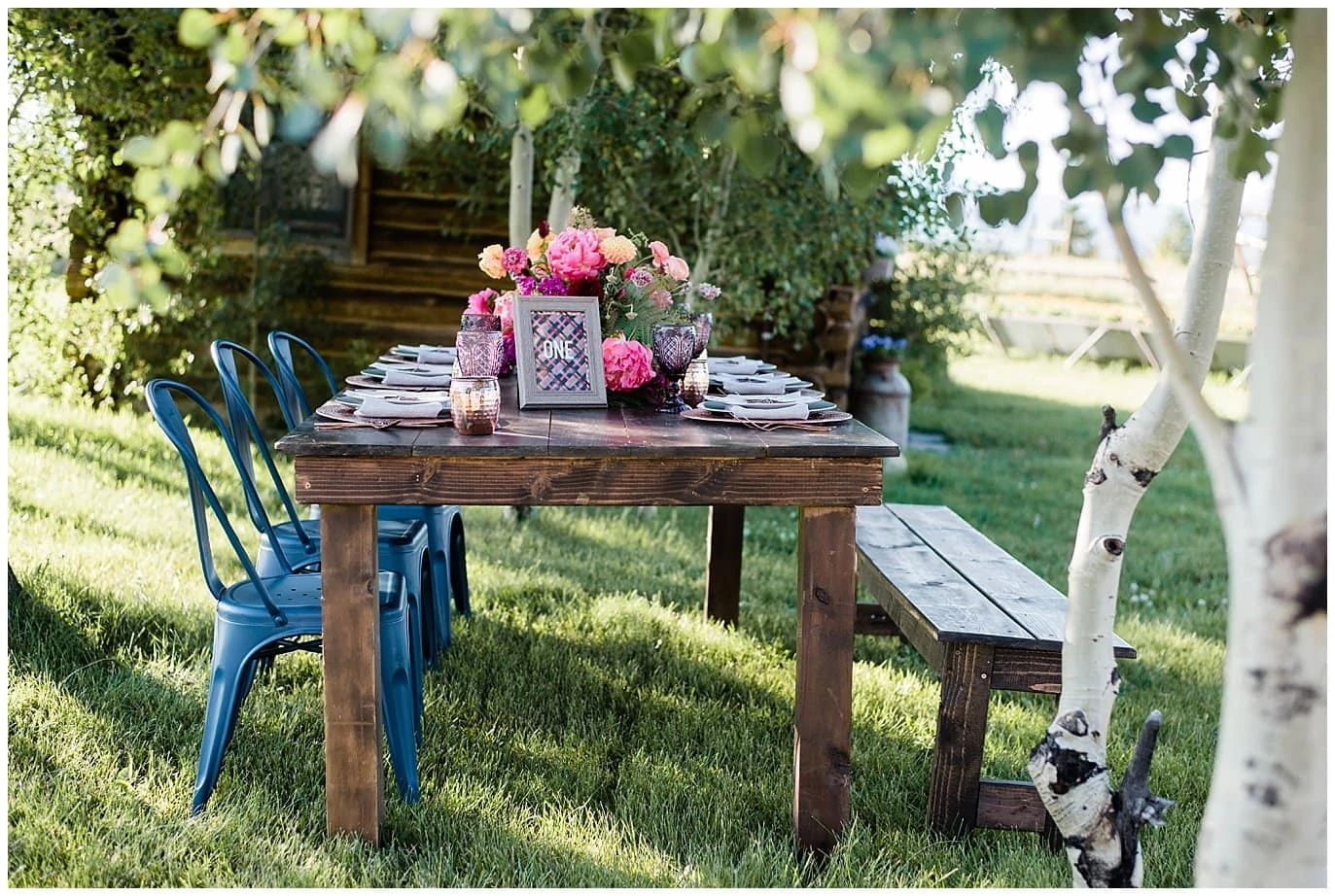 rusic farm table with colorful flowers photo