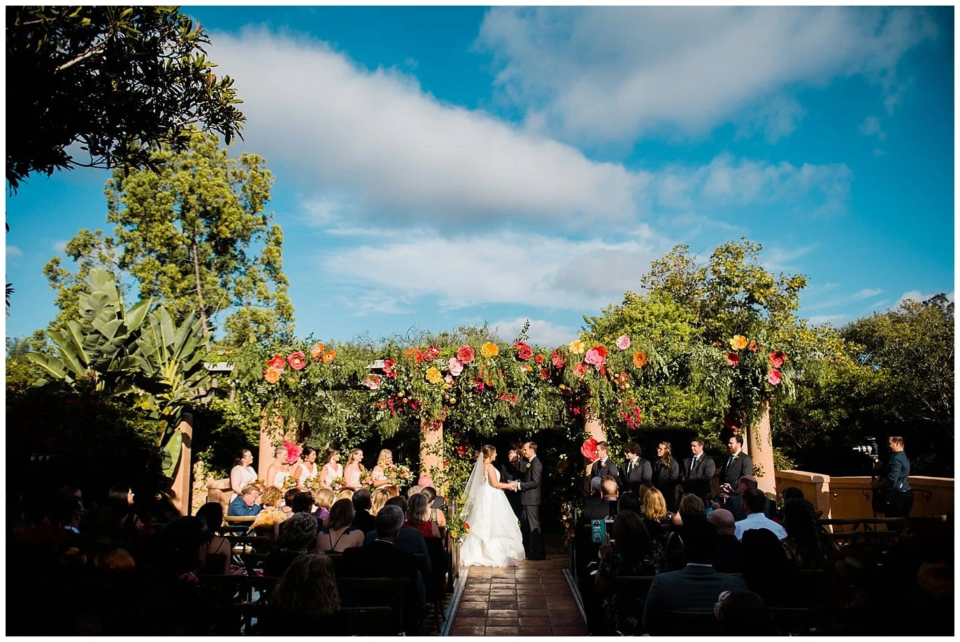 colorful Rancho Valencia wedding ceremony photo
