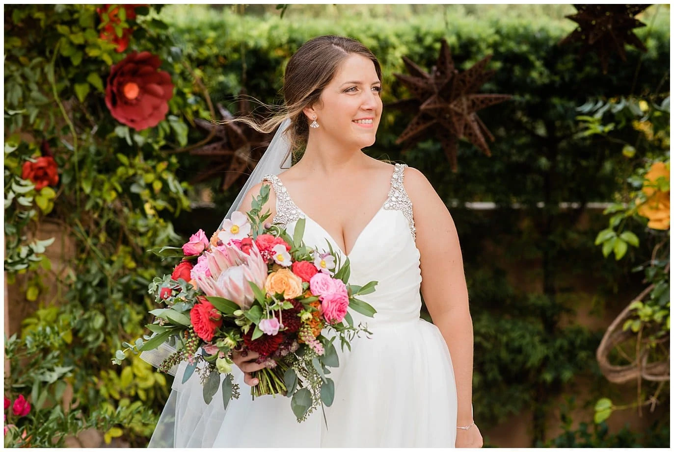 california bride with colorful wedding bouquet and hayley paige dress