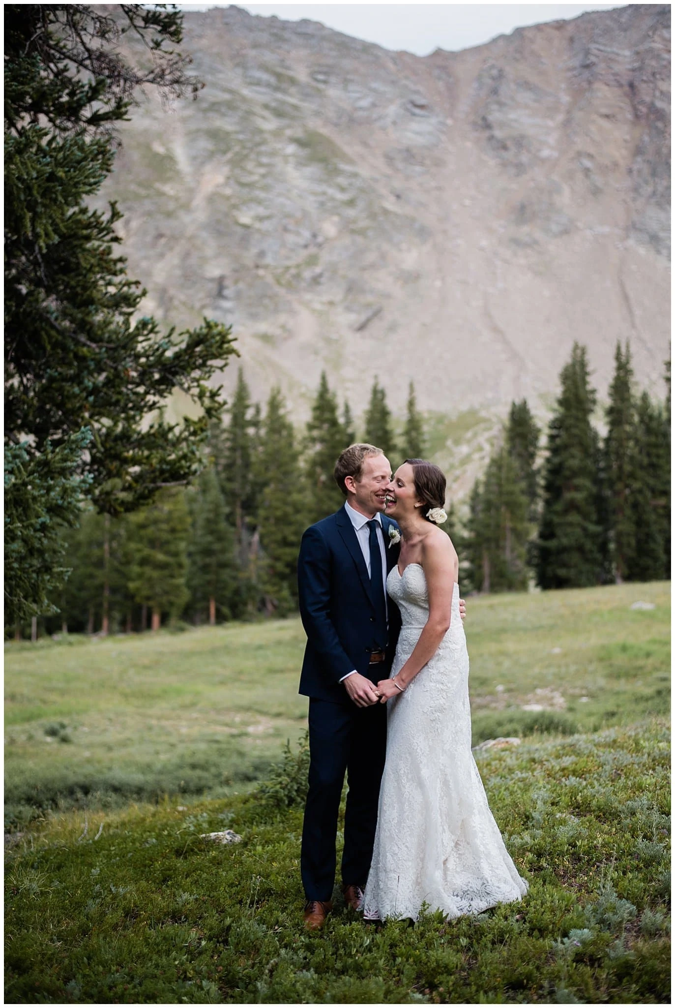 Bride and groom laughing at Arapahoe Basin Black Mountain Lodge Wedding by Arapahoe Basin Wedding Photographer Jennie Crate
