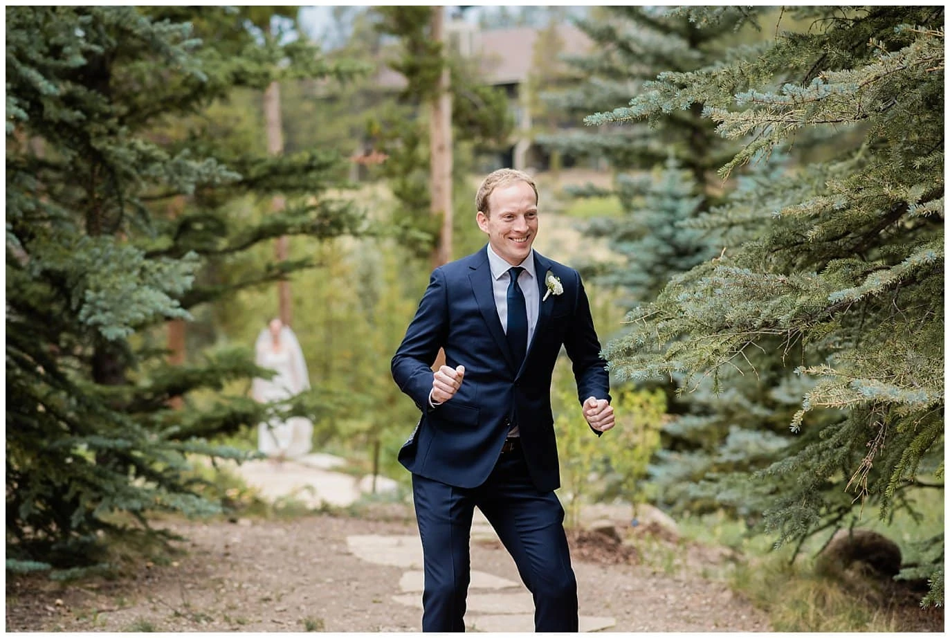 groom dancing during first look at Arapahoe Basin Black Mountain Lodge Wedding by Silverthorne Wedding Photographer Jennie Crate