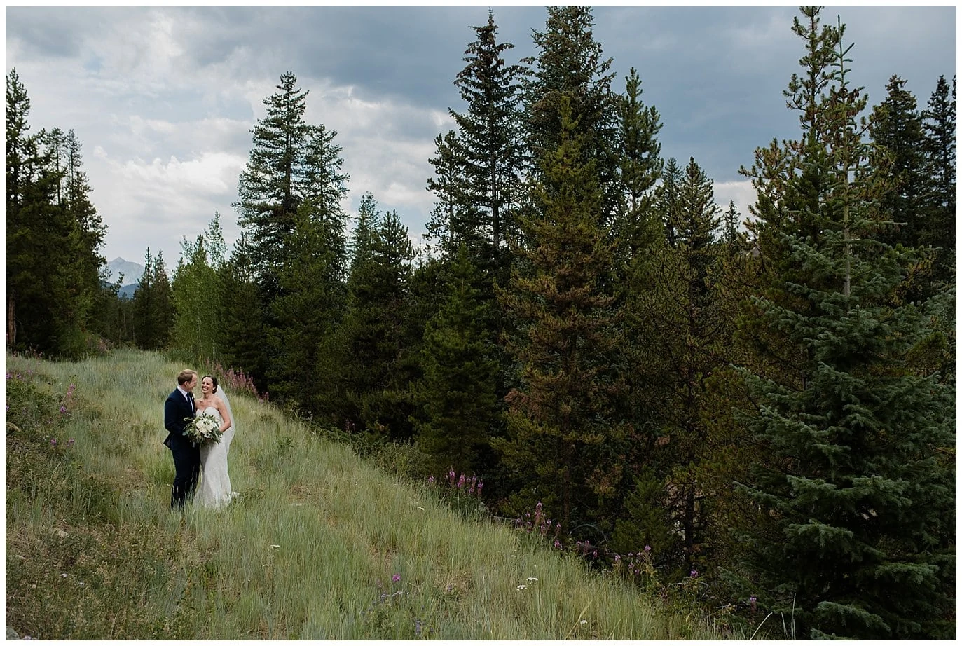 bride and groom in Colorado forest at Arapahoe Basin Black Mountain Lodge Wedding by Arapahoe Basin Wedding Photographer Jennie Crate