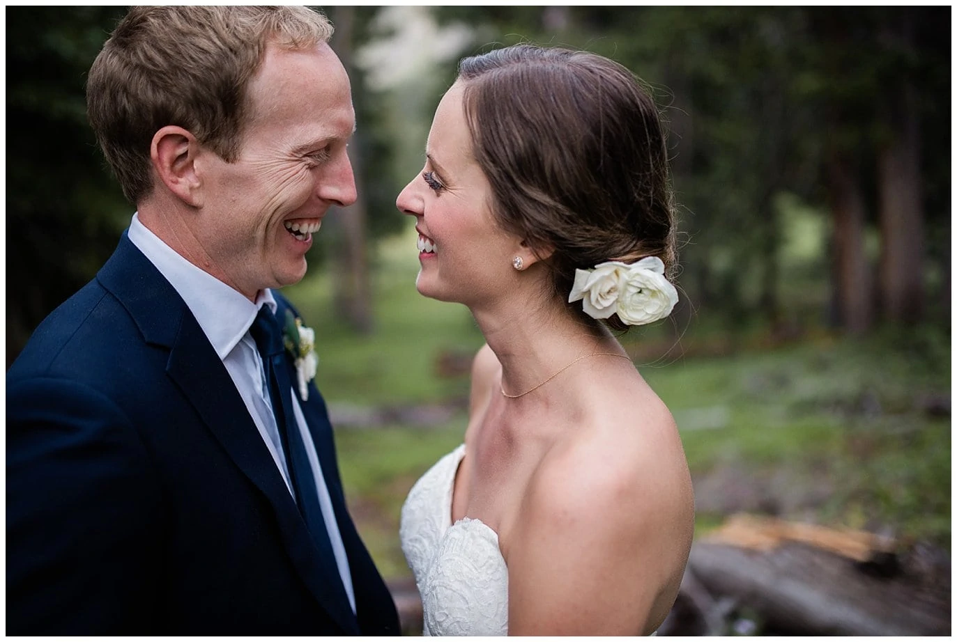 white flowers in bride's hair at Arapahoe Basin Black Mountain Lodge Wedding by Colorado Wedding Photographer Jennie Crate