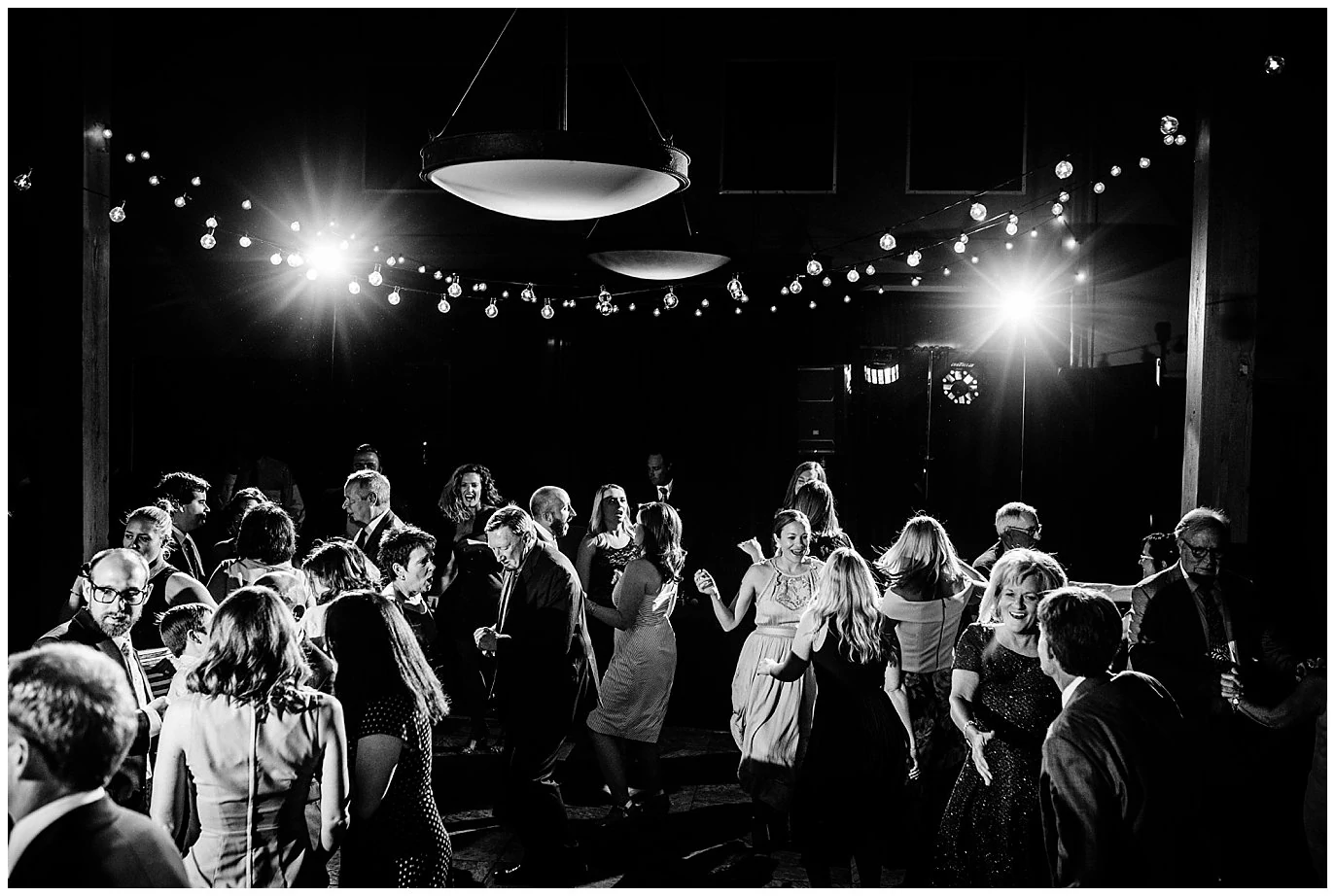 Group dance party at Arapahoe Basin Black Mountain Lodge Wedding by Dillon Wedding Photographer Jennie Crate