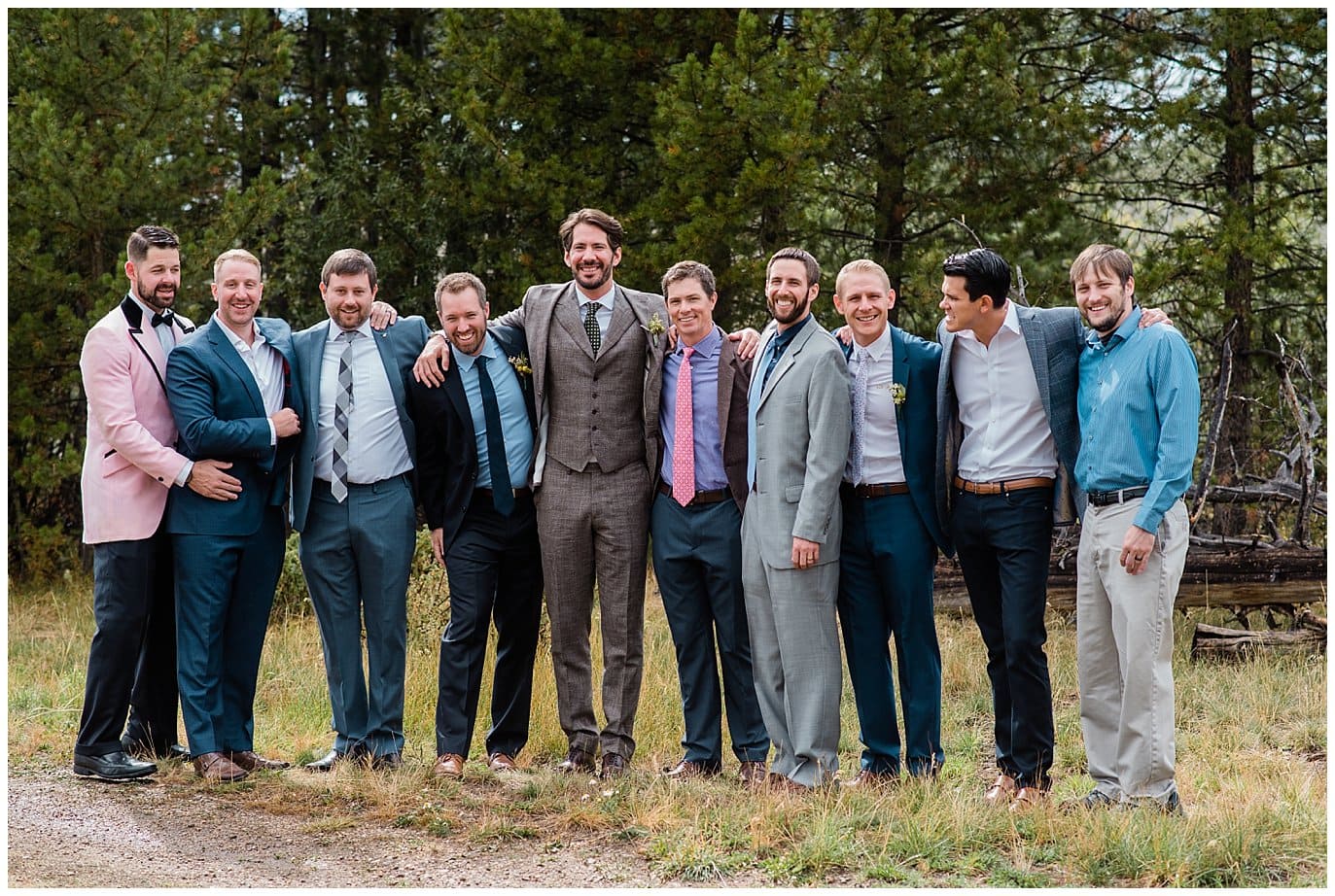 casual mis matched groom and groomsmen at Colorado mountain wedding photo