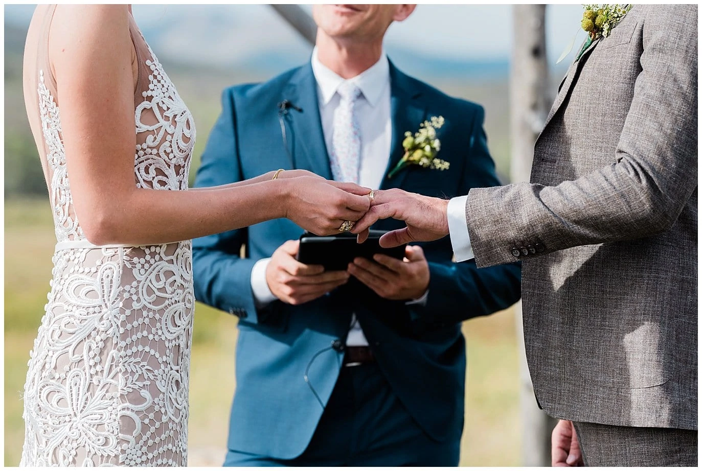 ring exchange bride in nude and lace dress, groom in tweed suit photo