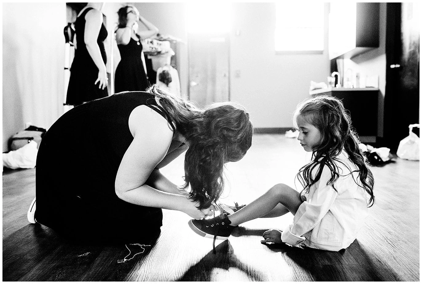 flower girl putting on converse photo