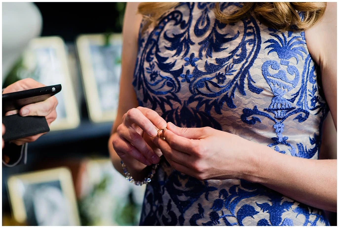 bride in blue dress with wedding ring photo