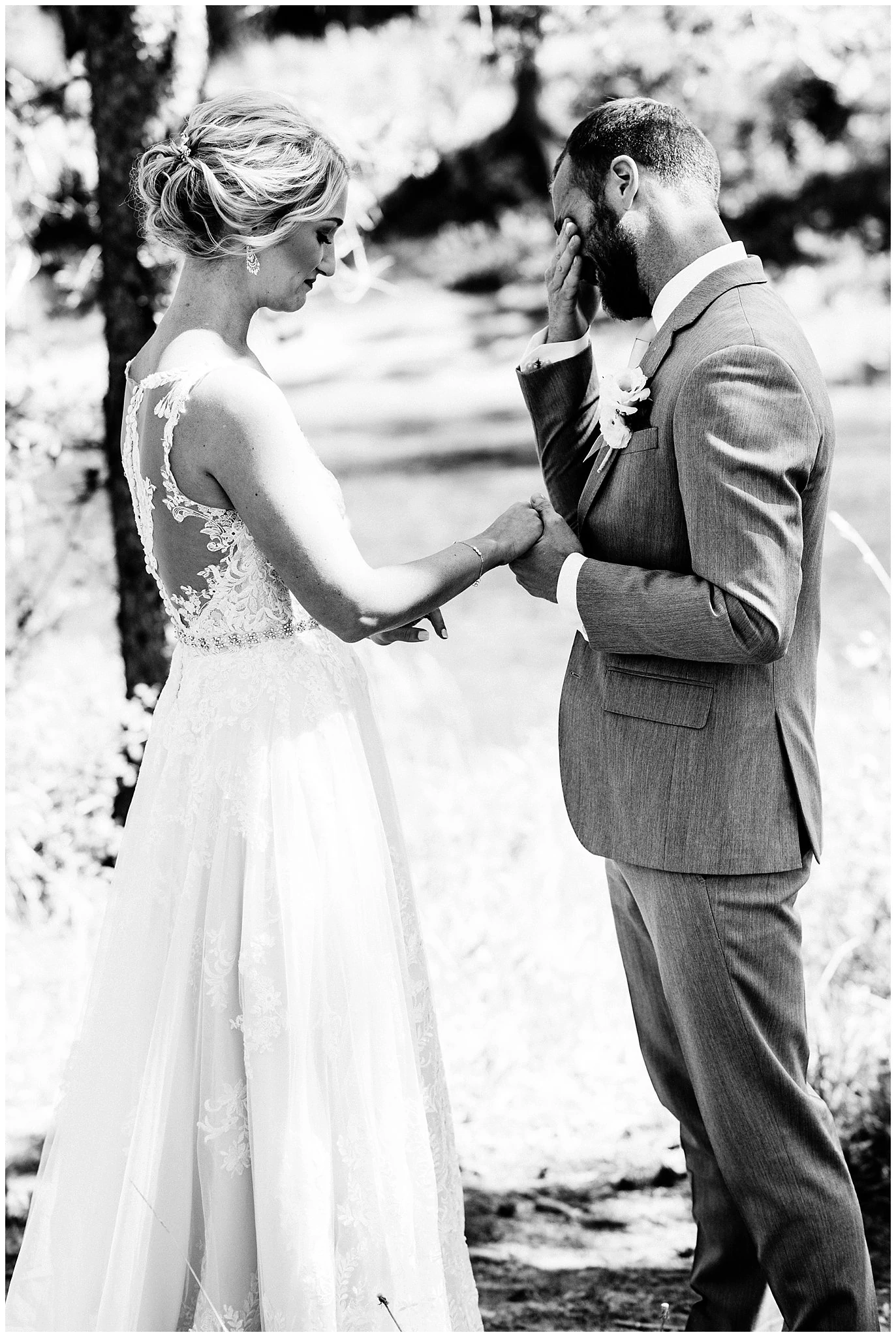 emotional first look by river at Elegant Piney River Ranch wedding by Piney River Ranch wedding photographer Jennie Crate, Photographer