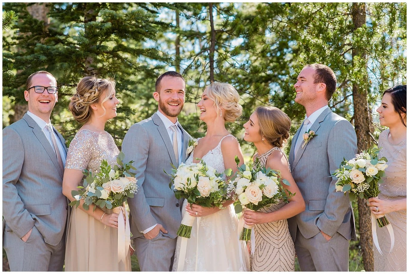bright elegant wedding party in champagne wedding dresses and grey suites at Elegant Piney River Ranch wedding by Piney River Ranch wedding photographer Jennie Crate, Photographer