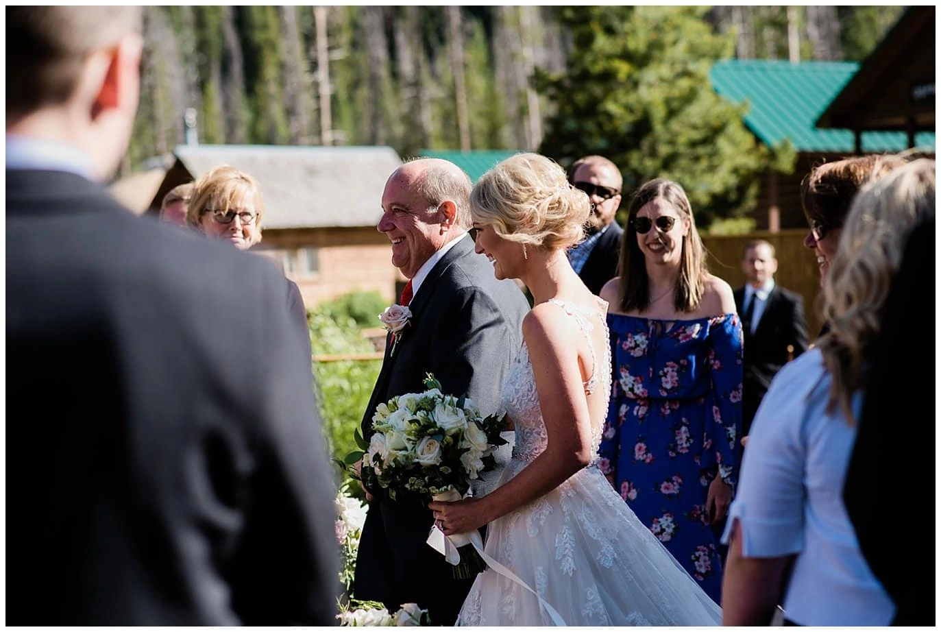 bride walking down aisle at at Piney River Ranch wedding by Beaver wedding photographer Jennie Crate, Photographer