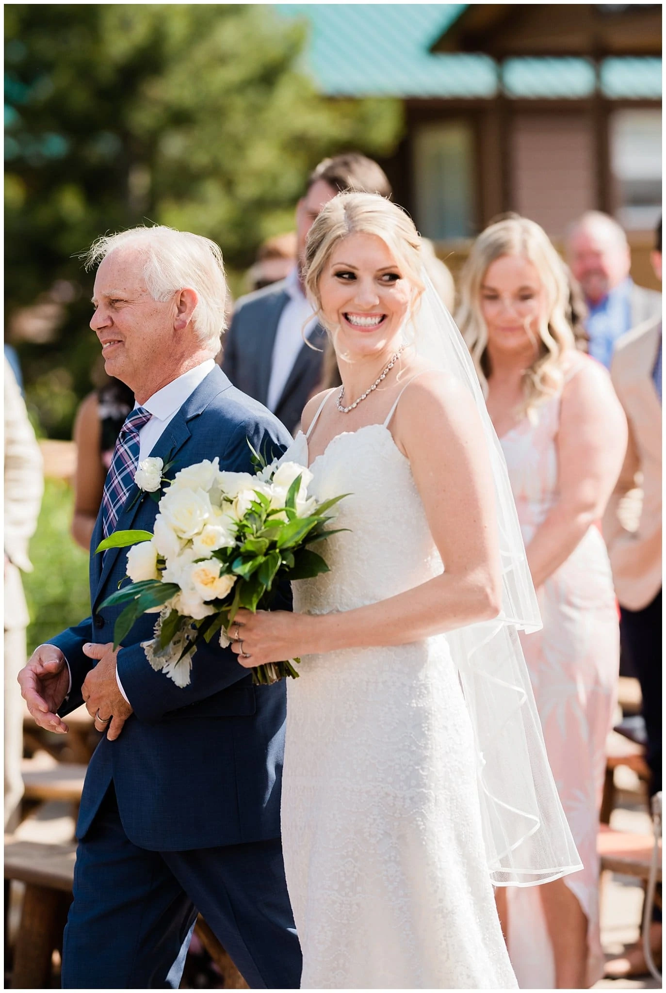 father walks daughter down the aisle at intimate Colorado wedding at Piney River Ranch Summer Wedding by Rocky Mountain wedding photographer Jennie Crate photographer