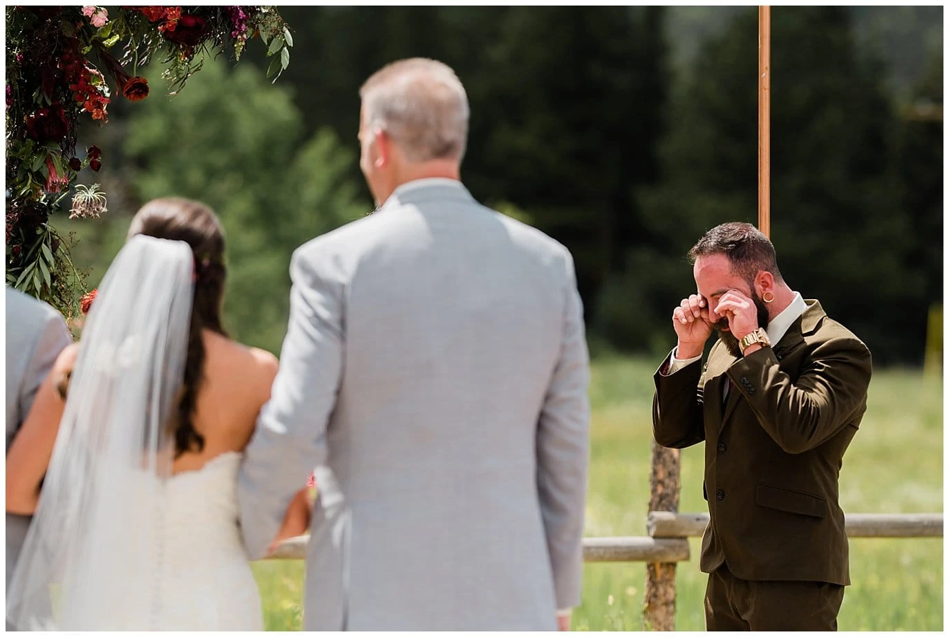 emotional groom when bride walks down aisle photo