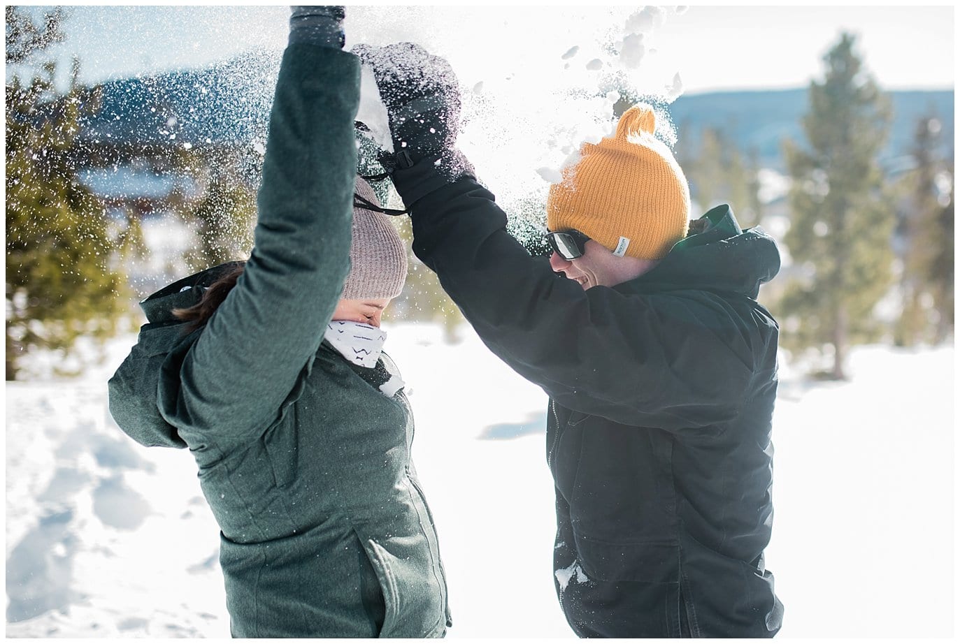 snow fight during colorado engagement session photo