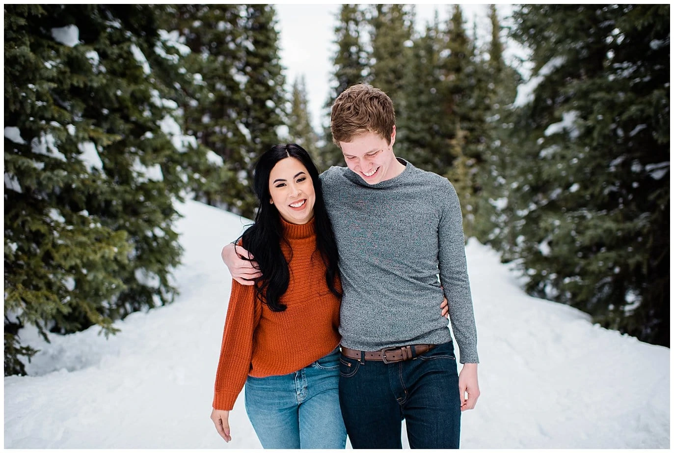 snowy hiking engagement photo at Mayflower Gulch by Leadville wedding photographer Jennie Crate