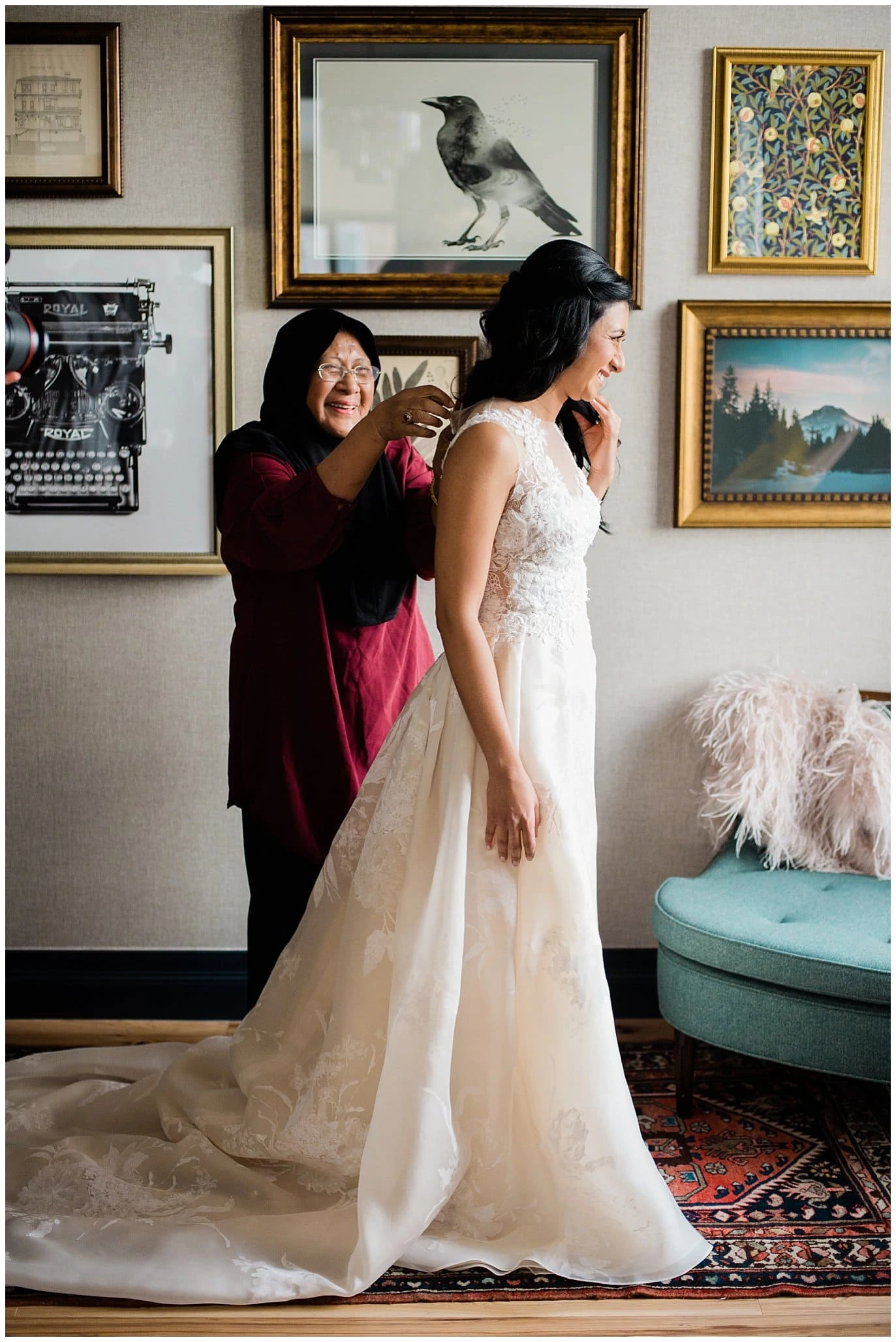 bride getting dresses at Denver city wedding photo by Blanc Wedding Photographer Jennie Crate