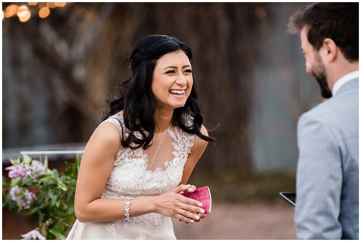 bride laughing during vows by Blanc Wedding Photographer Jennie Crate