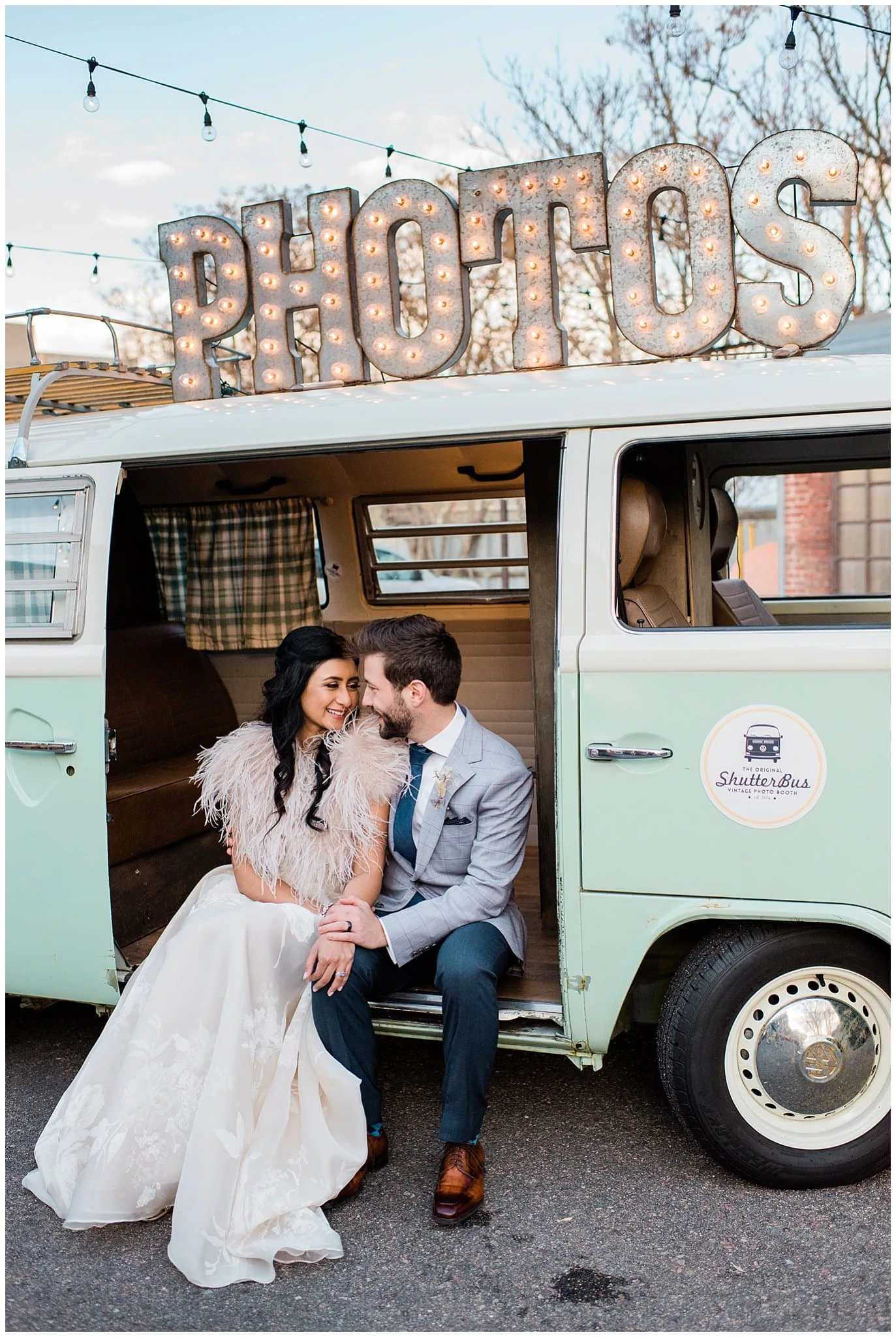 bride and groom in shutter bus photo booth at Blanc wedding by Denver Wedding Photographer Jennie Crate