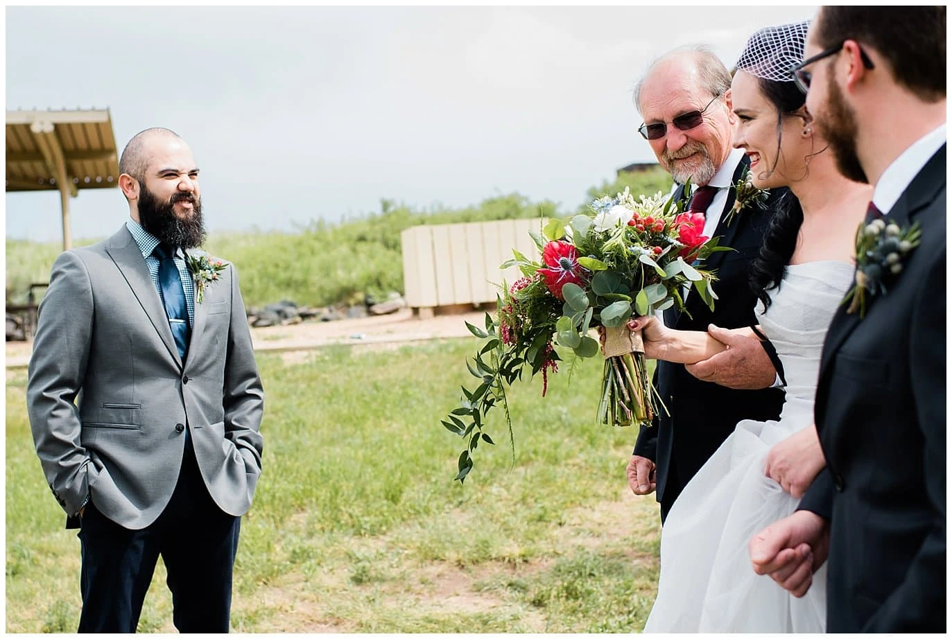 groom seeing bride for first time at wedding photo