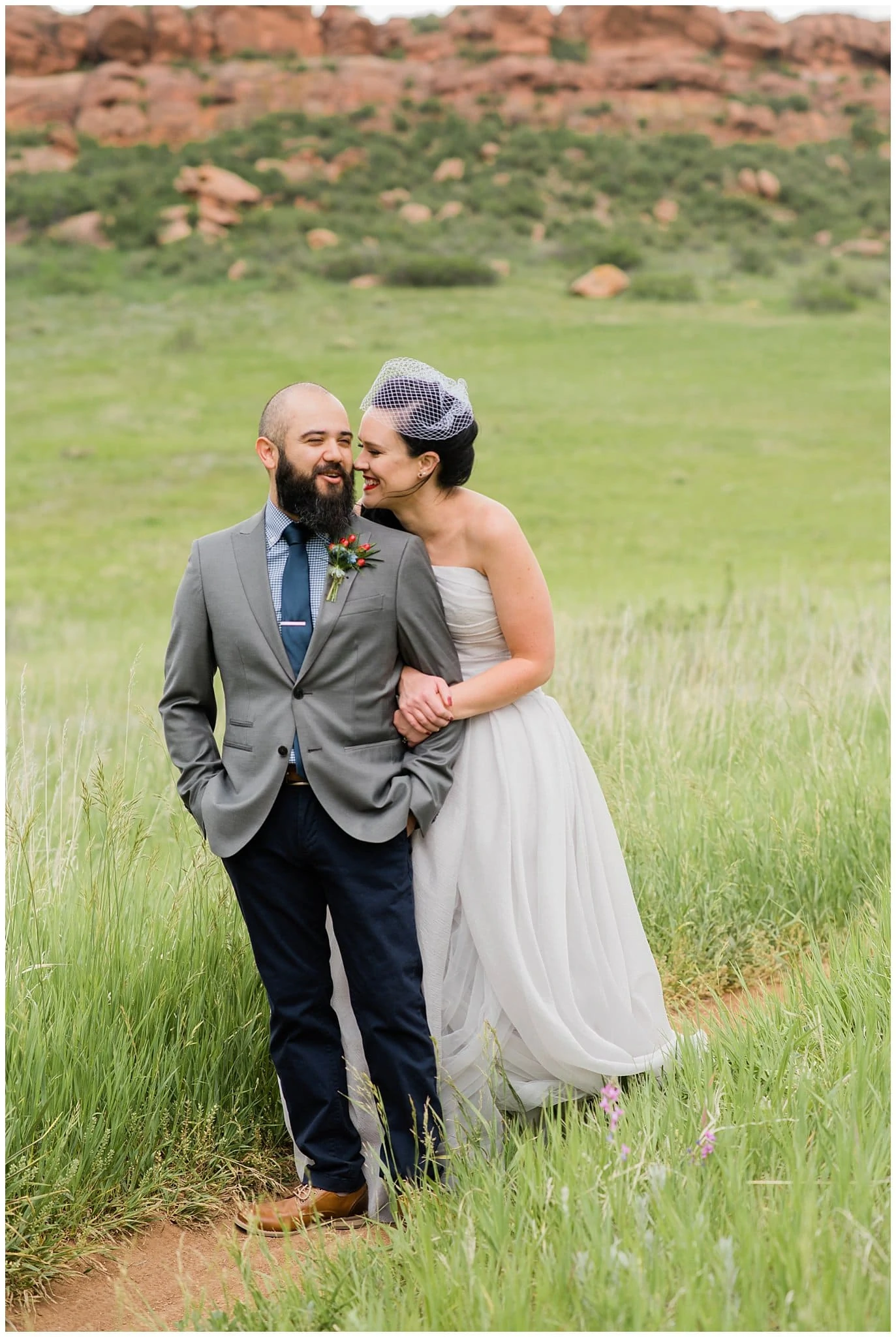 bride and groom in field in Fort Collins photo
