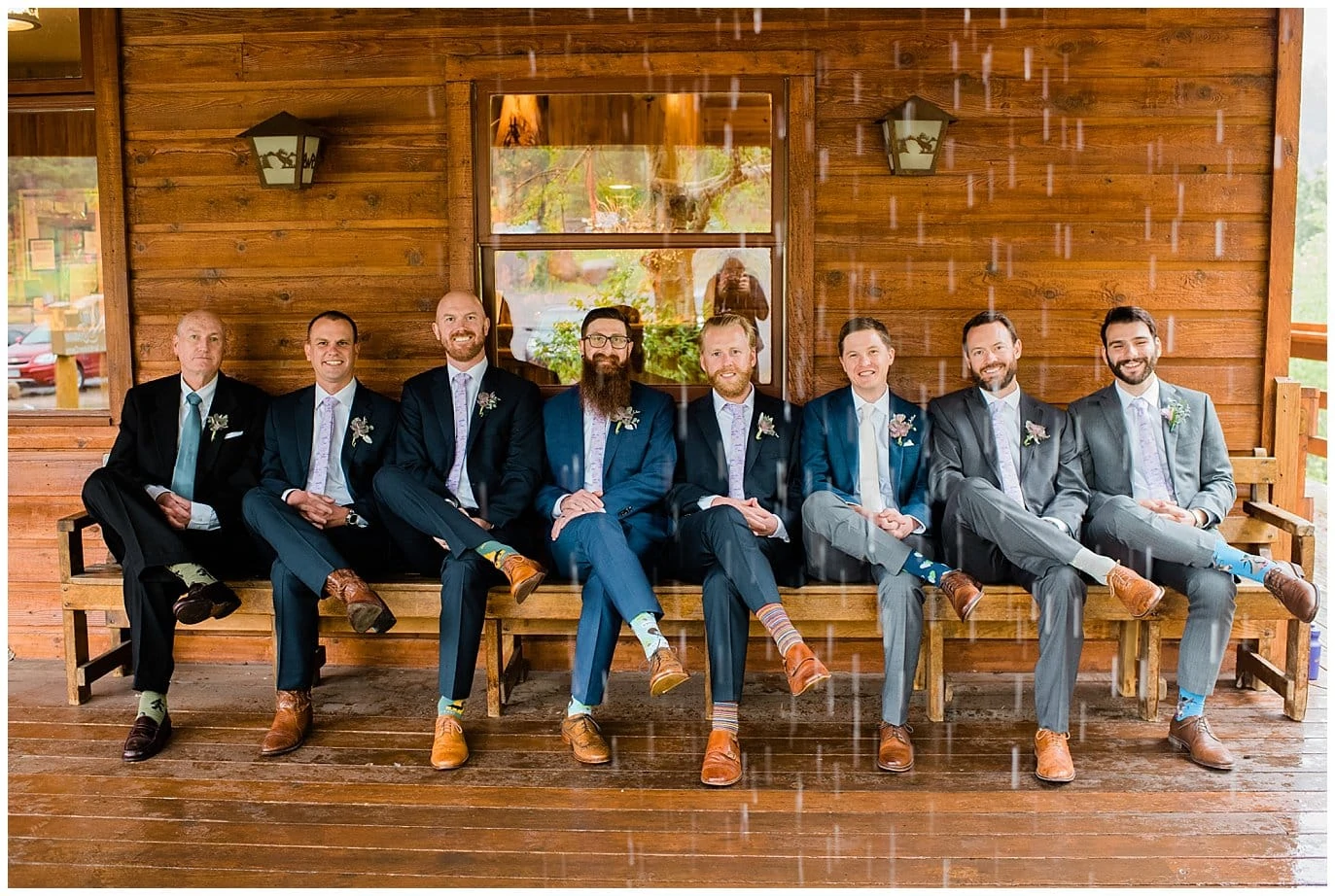 groomsmen hanging out in the rain photo