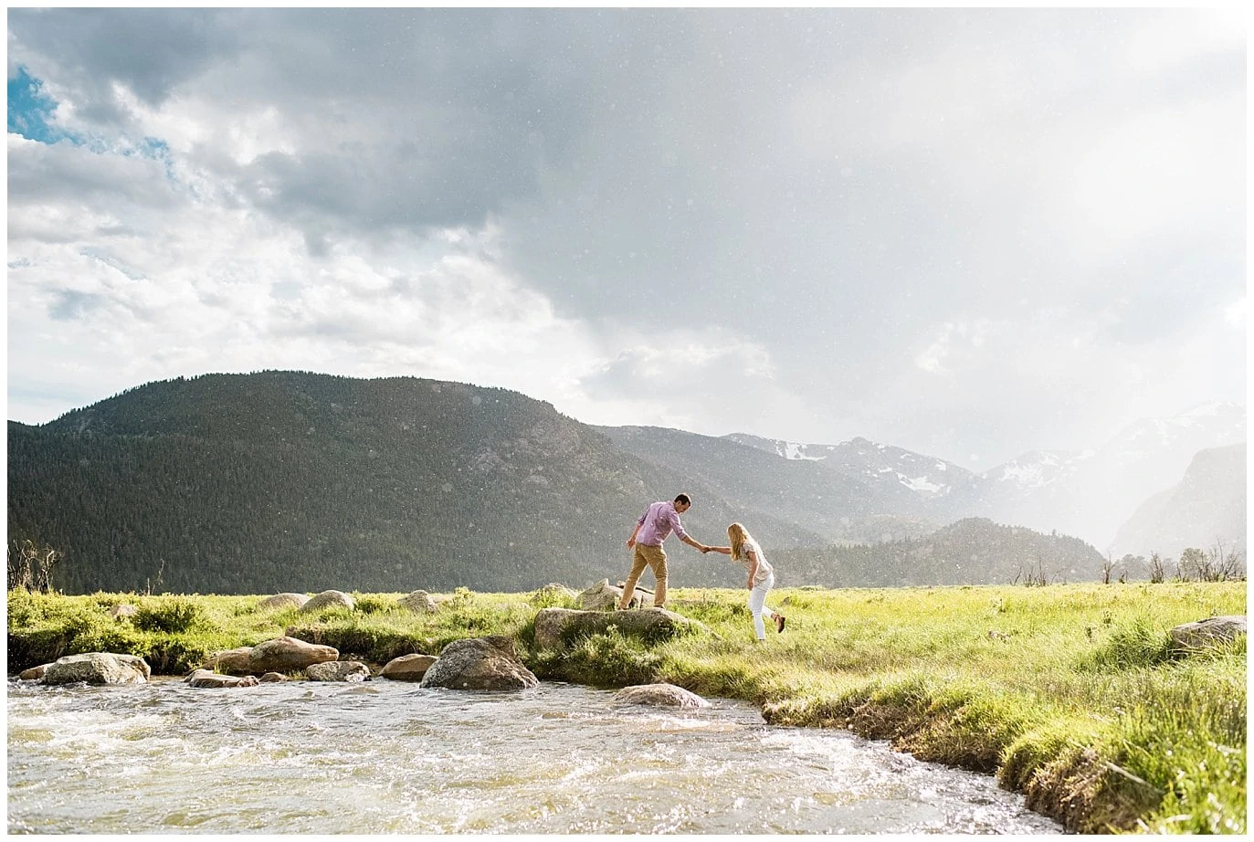 Colorado engagement photo by river at Moraine Park by Rocky Mountain National Park wedding photographer Jennie Crate