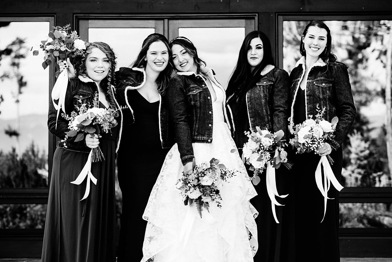 bridal party in custom jean jackets at B Lazy 2 Ranch wedding by Fraser wedding photographer Jennie Crate