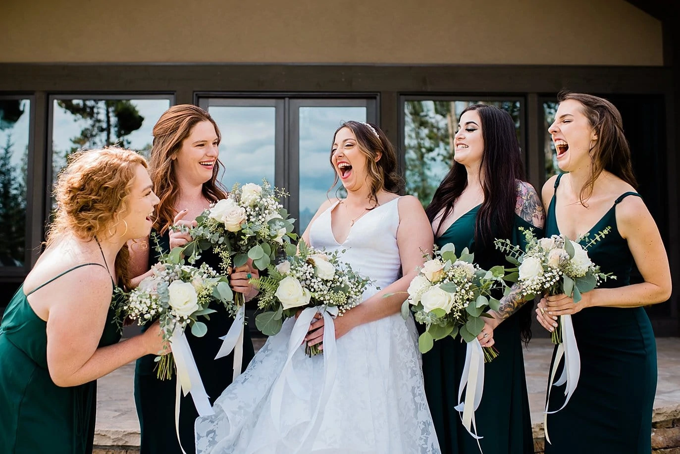 bridesmaids laughing at B Lazy 2 Ranch wedding by Winter Park wedding photographer Jennie Crate