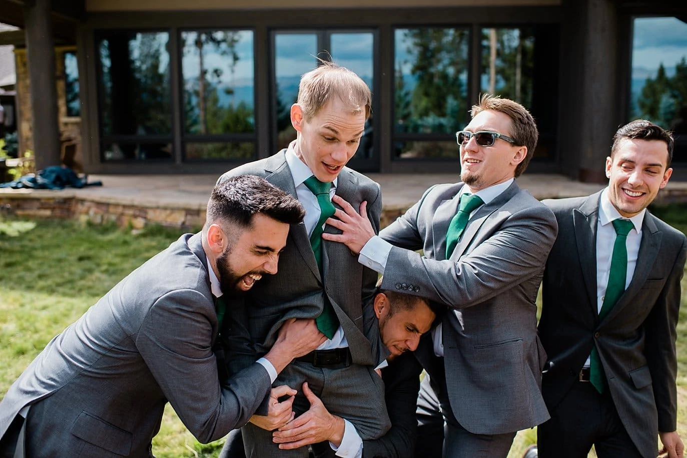 groomsmen picking up groom at B Lazy 2 Ranch wedding by Fraser wedding photographer Jennie Crate