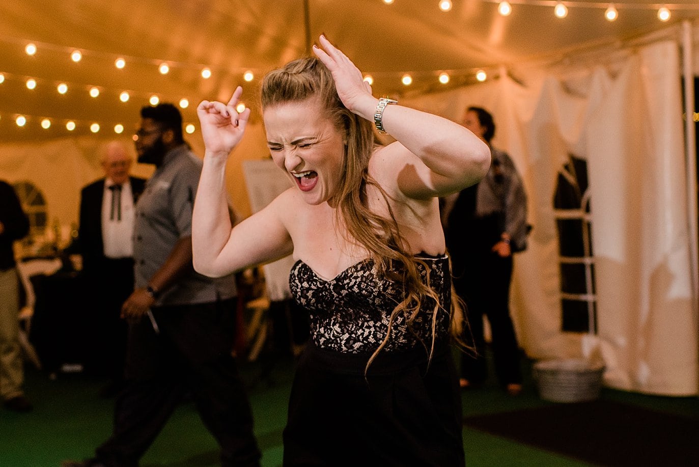 wedding guest crazy dancing during reception at B Lazy 2 Ranch by Tabernash wedding photographer Jennie Crate