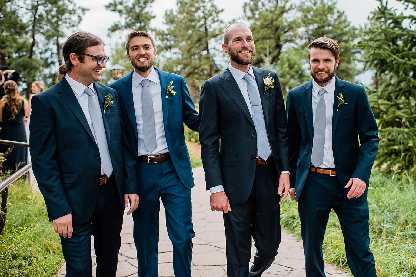 groom and groomsmen in mismatched navy blue suits and periwinkle ties
