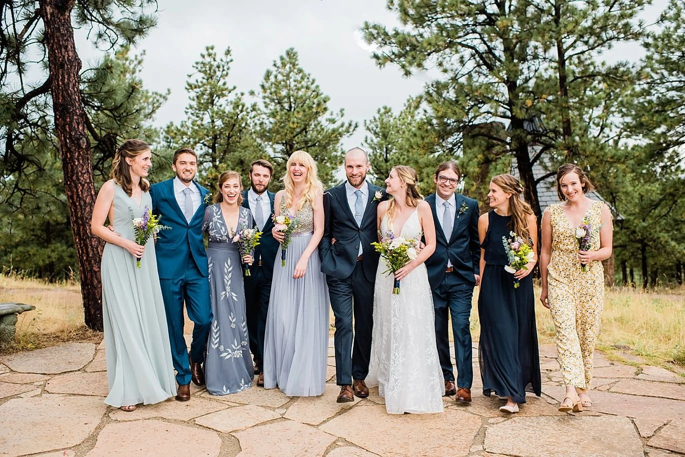 blue green and navy bridal party at romantic golden wedding