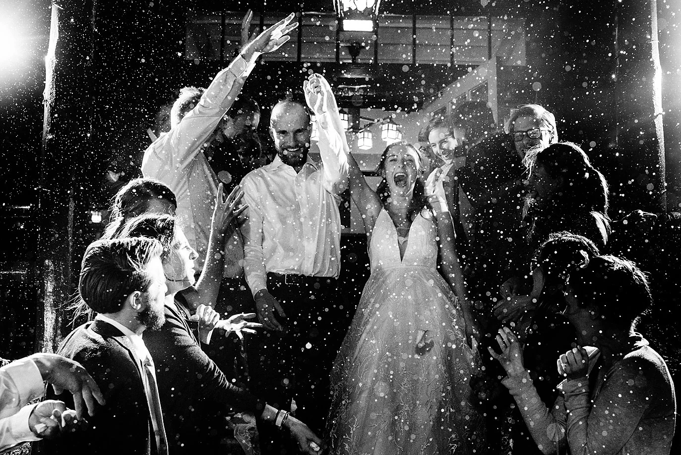 bride and groom grand exit the ceremony at the rainy boettcher mansion wedding
