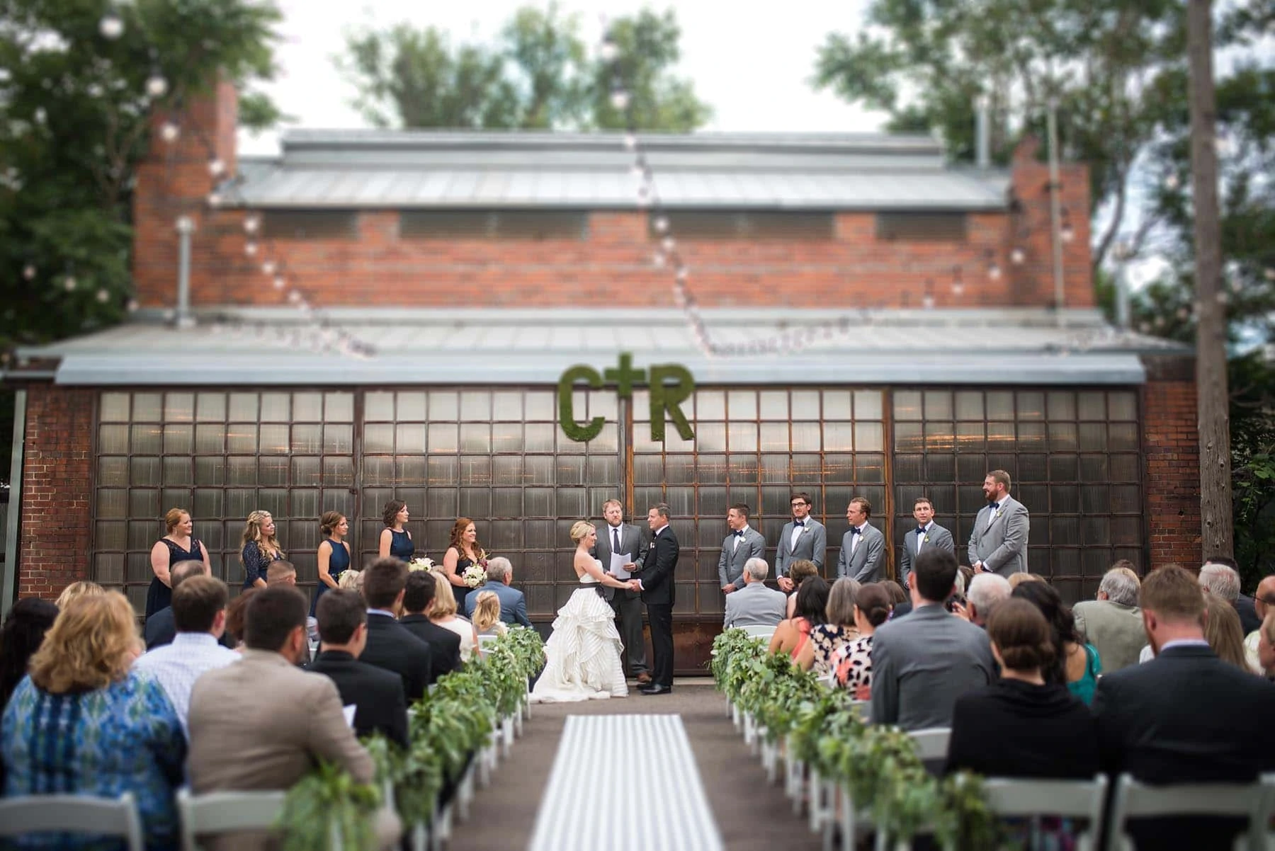 bride and groom on outdoor plaza at blanc Denver wedding by Denver Wedding Photographer Jennie Crate, Photographer