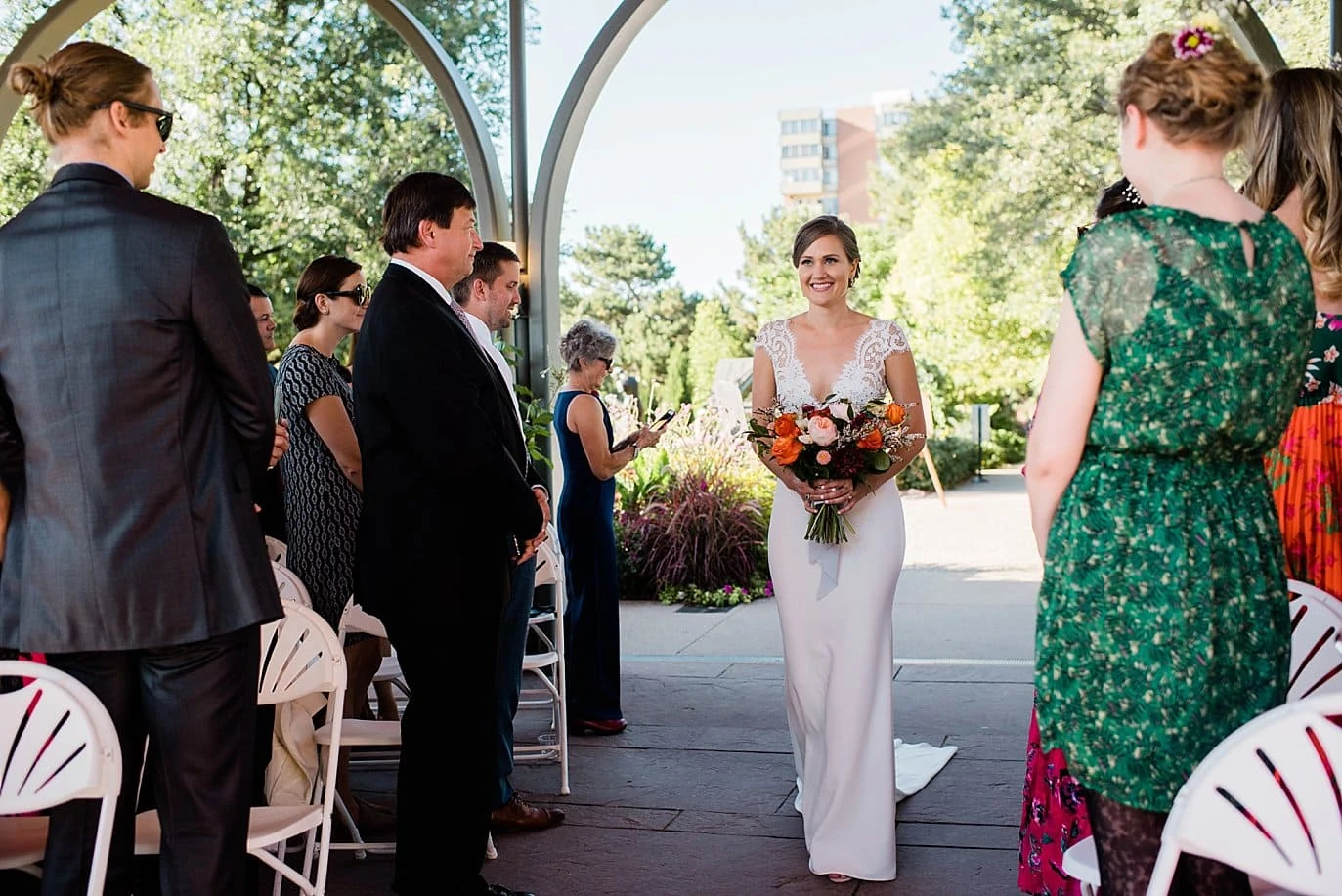 bride walking down aisle in Annuals garden at Denver Botanic Gardens Wedding by Denver Wedding Photographer Jennie Crate
