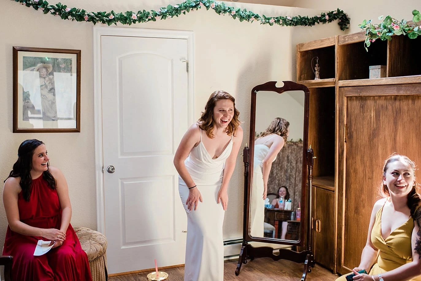 bride laughing right after she gets dressed on Evergreen wedding day